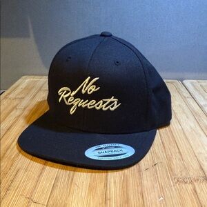 Croton Black Snapback Hat with White stitch “ No Requests “